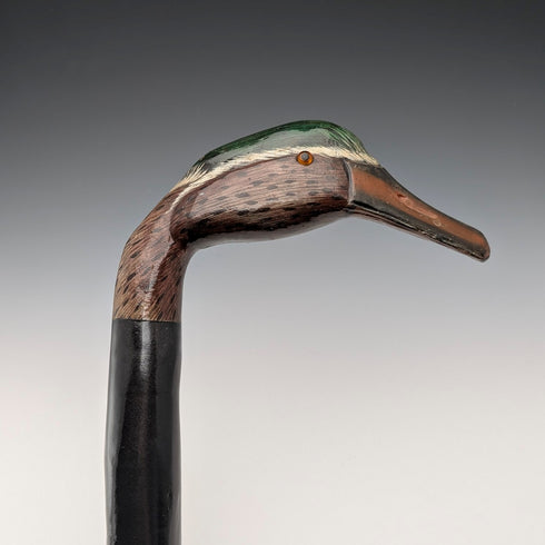 British vintage twisted black shaft walking stick with painted duckhead handle, 94cm